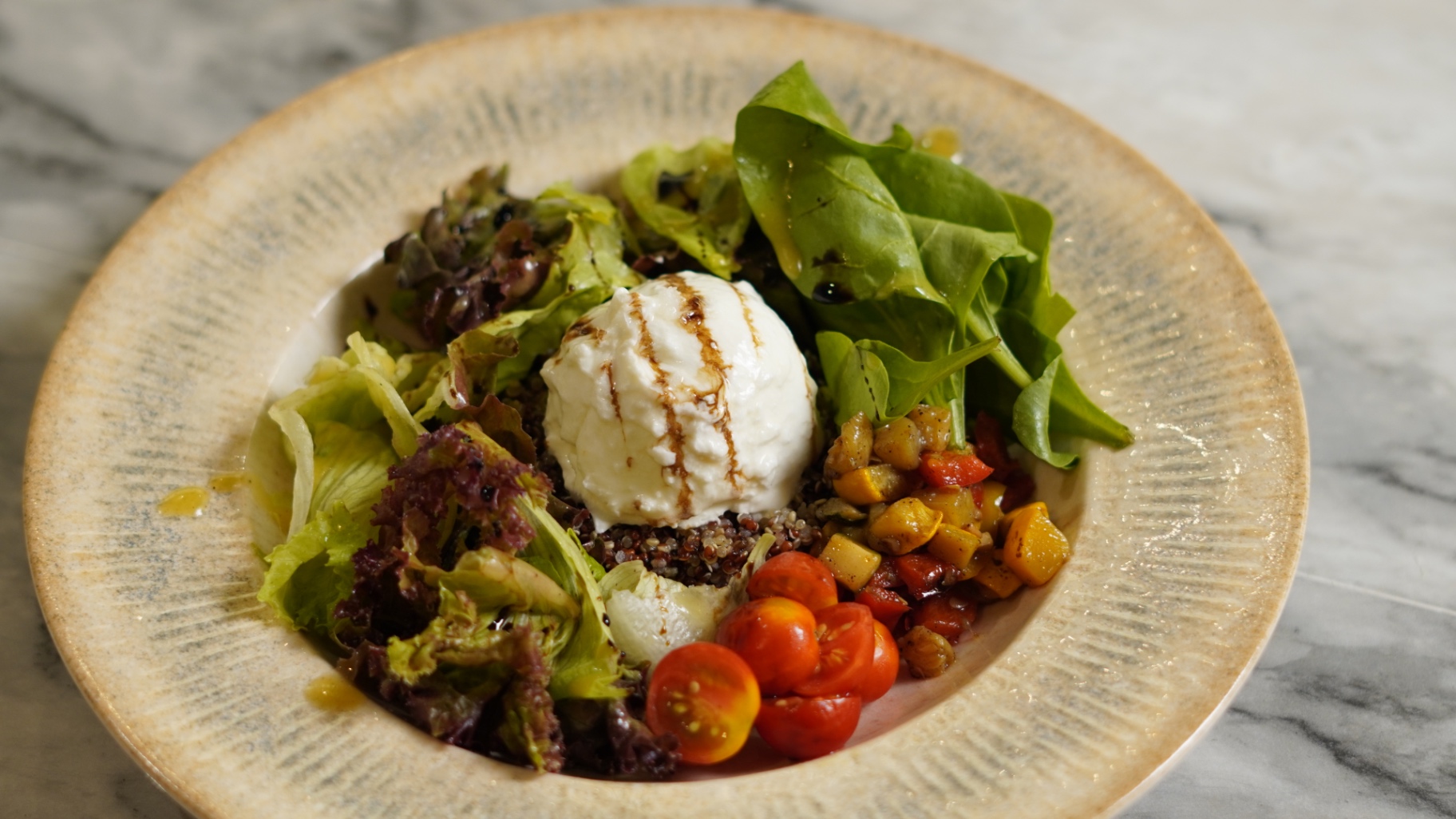 Hand torn burrata bowl with ratatouille, quinoa, cherry tomato and baby spinach